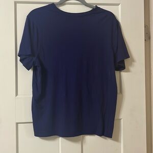 Size large basic tea it’s a blue purple color